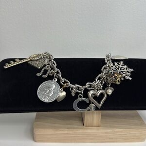Avon Silver Toned Bracelet with various charms